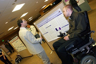 Student Presenting Research Poster